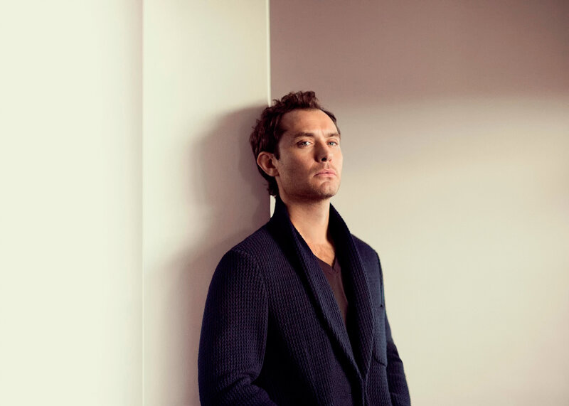 Man Leaning Against Wall — White, Contemplative