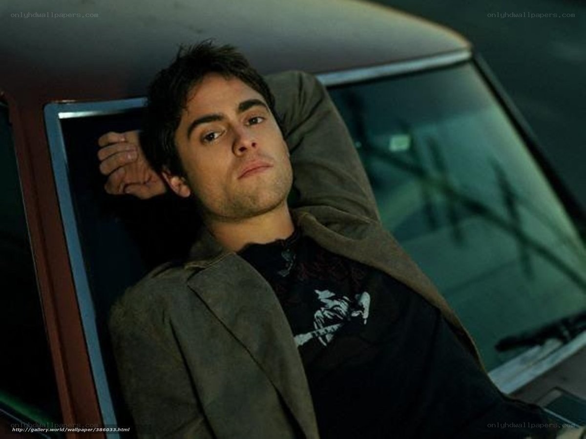 man leaning in car window