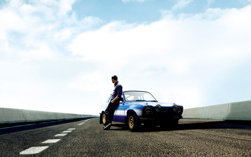Man Leaning on Blue Car — Dramatic, Afternoon