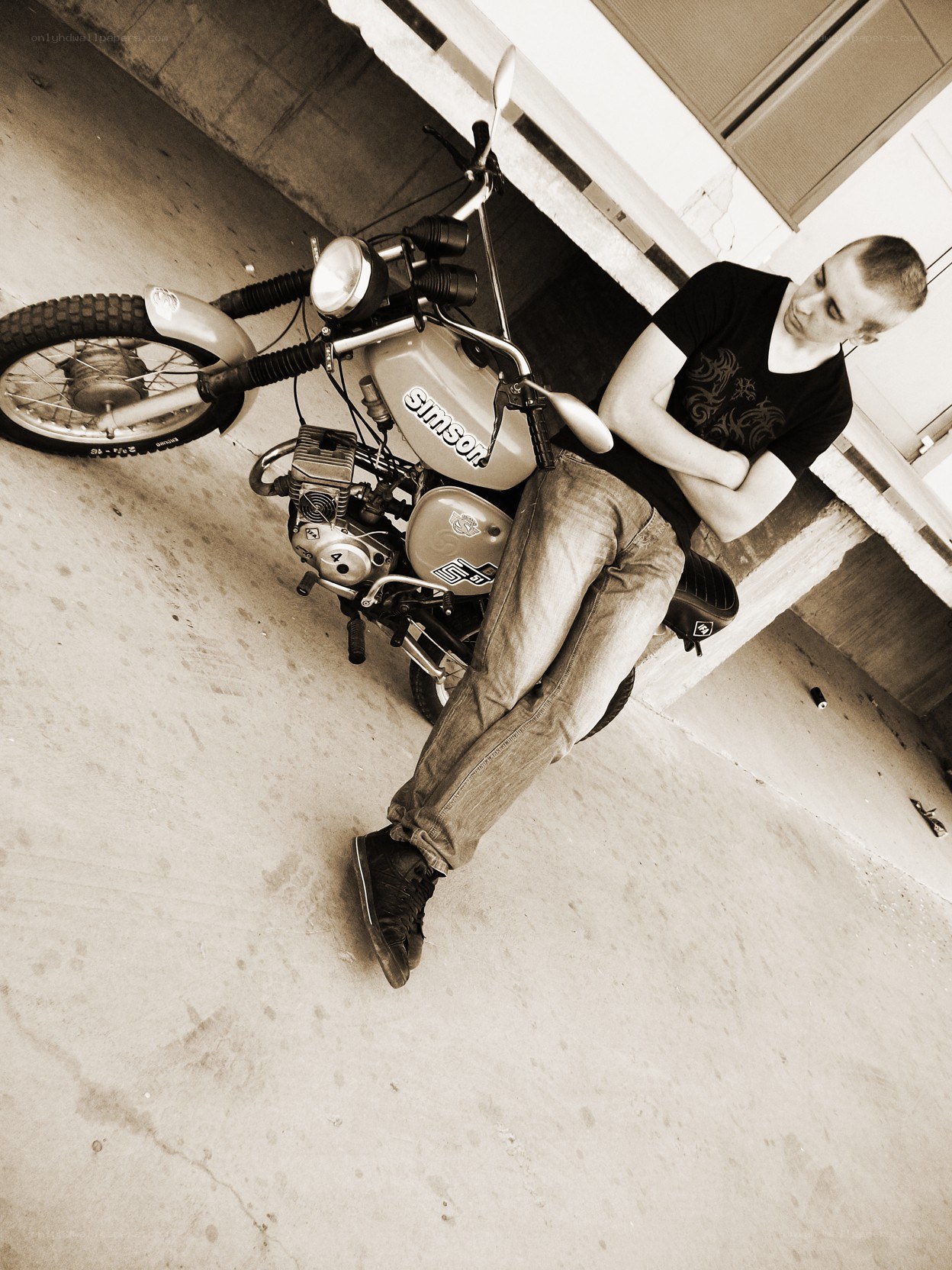man leaning on motorcycle