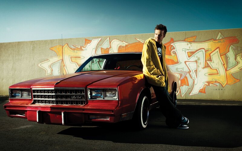 Man Leaning on Red Car — Dramatic