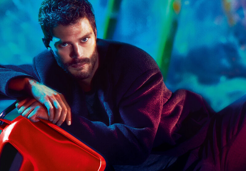 man leaning on red object