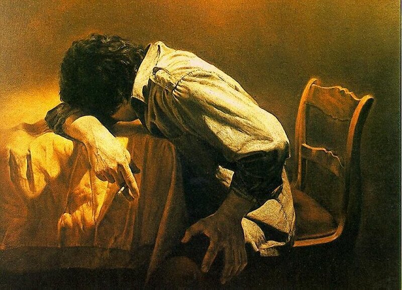 man leaning on table
