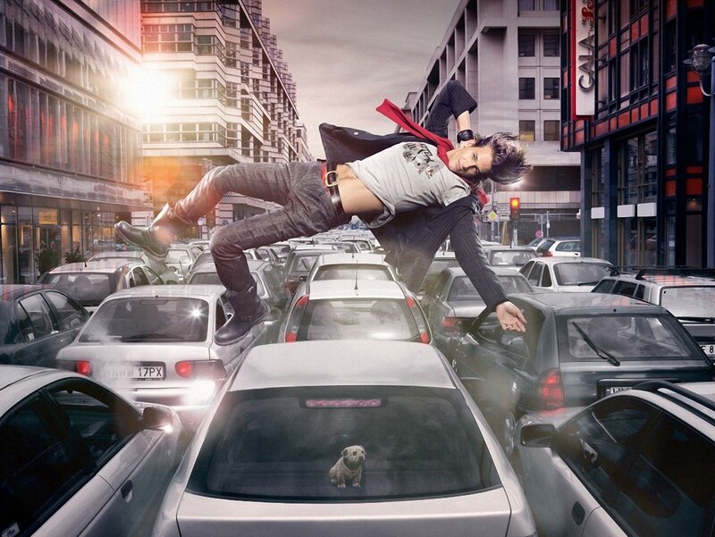 Man leaping over traffic