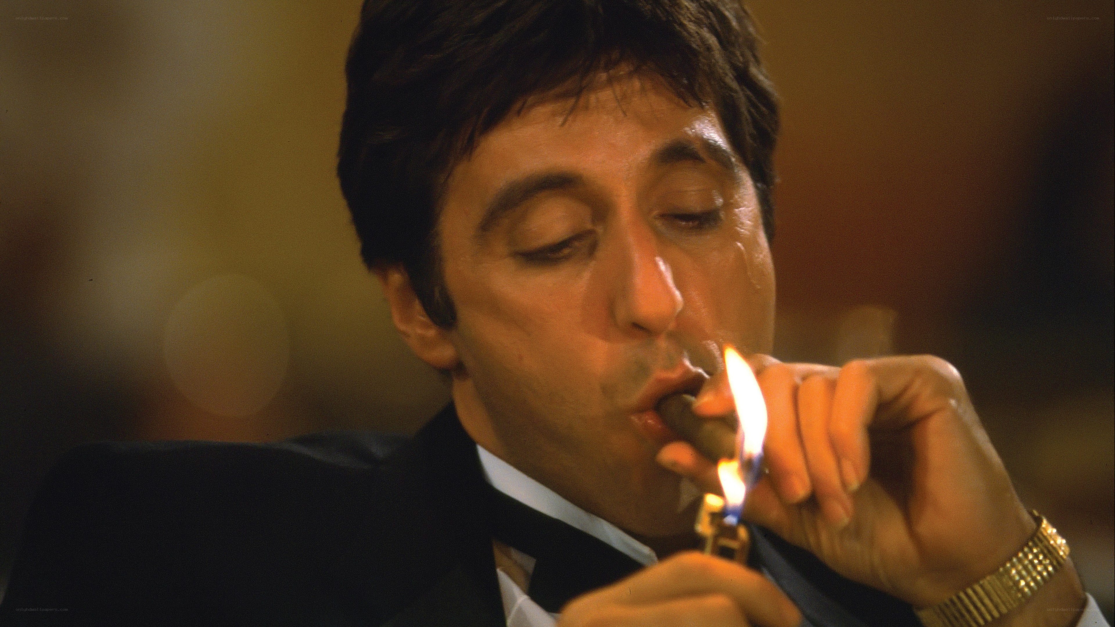 man lighting a cigar
