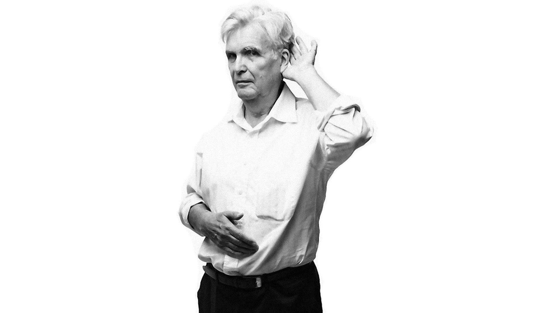 man listening with hand to ear