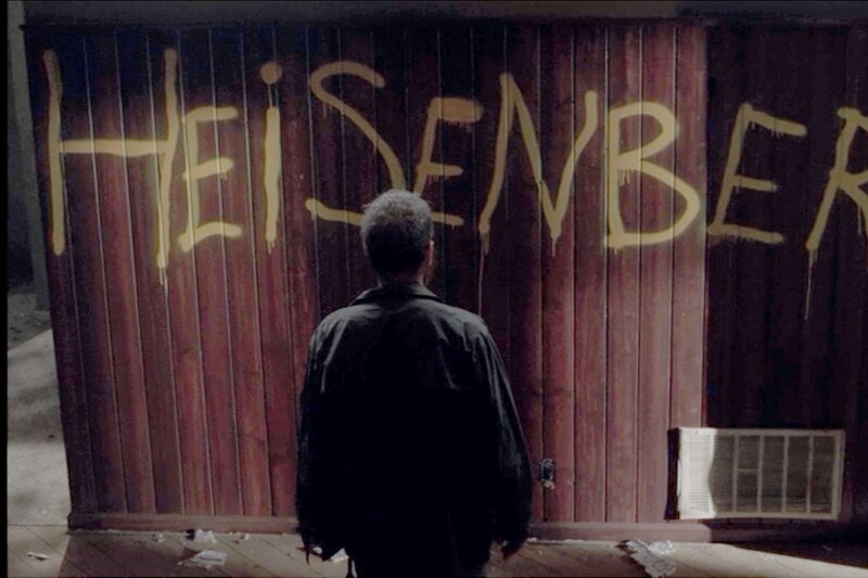 Man Looking at Graffiti