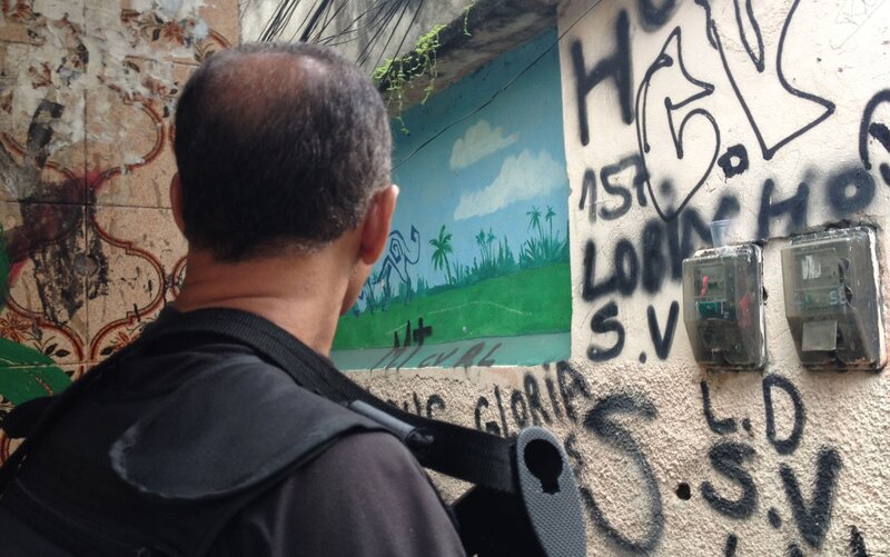 man looking at graffiti wall