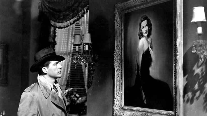 man looking at portrait