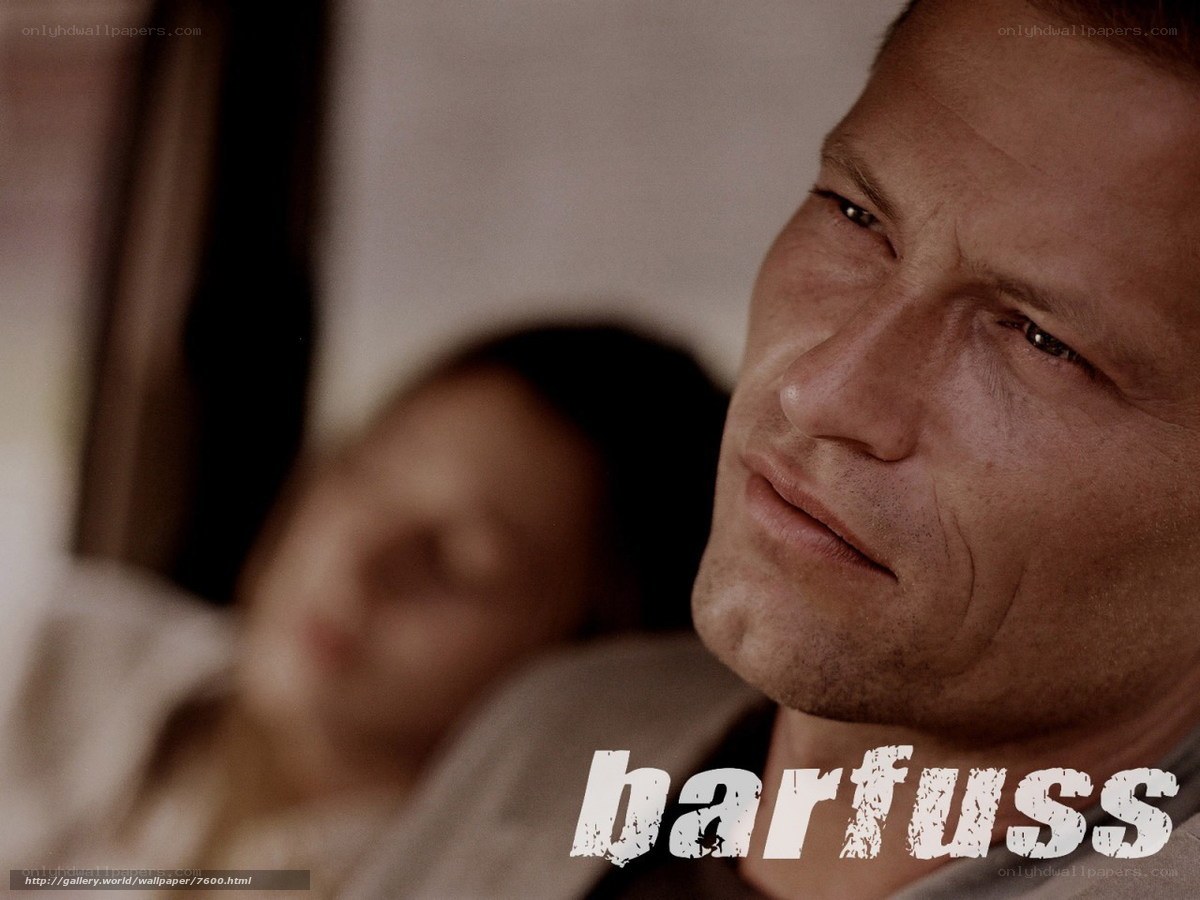 Man looking at sleeping woman