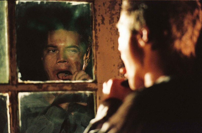 Man looking in a mirror