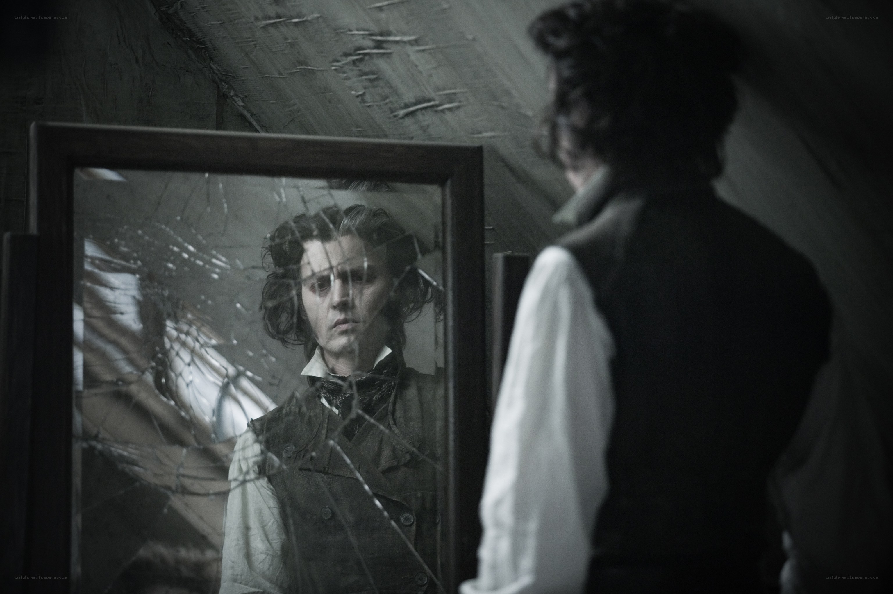 man looking in broken mirror