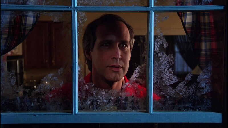 man looking through frosted window