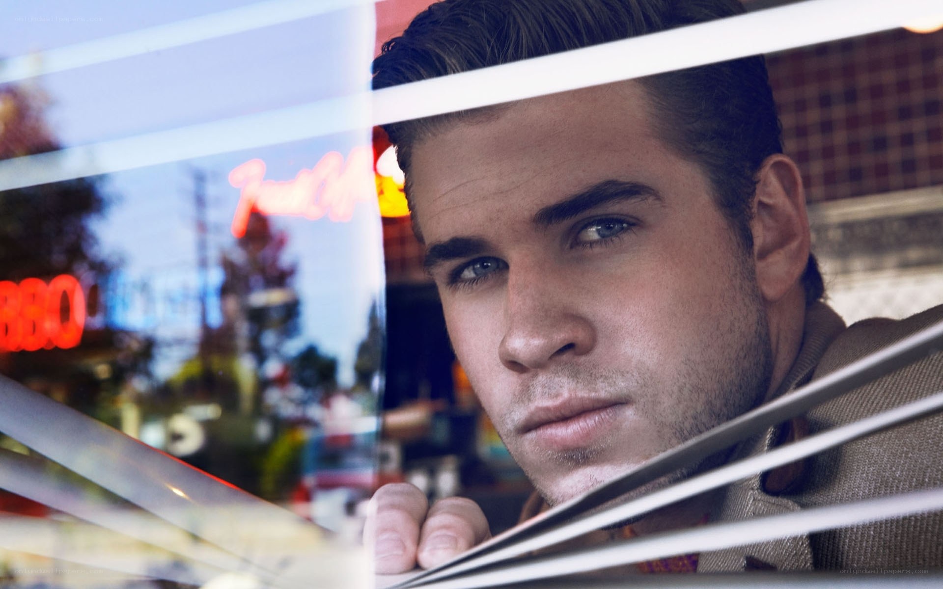 man looking through window
