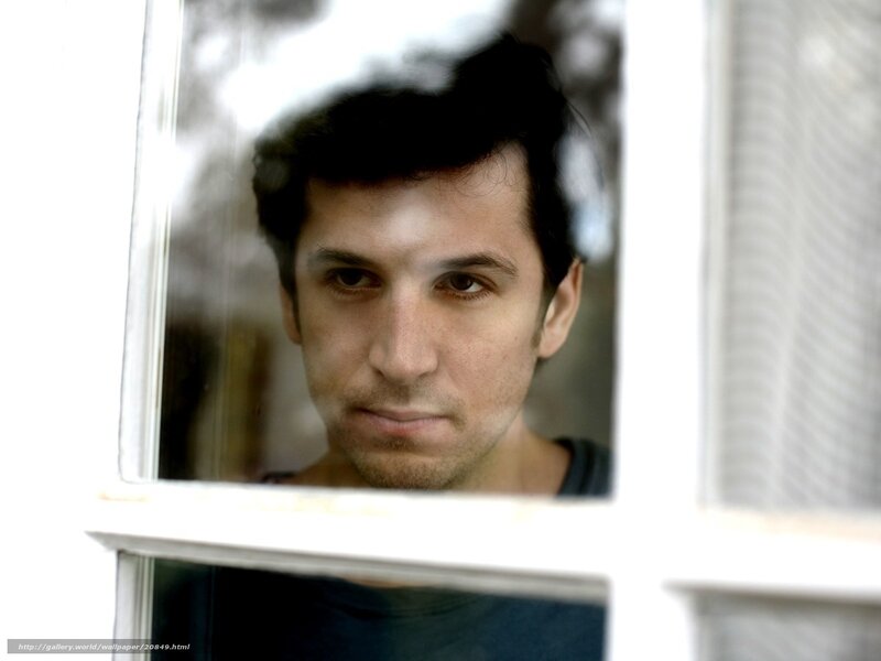 man looking through window