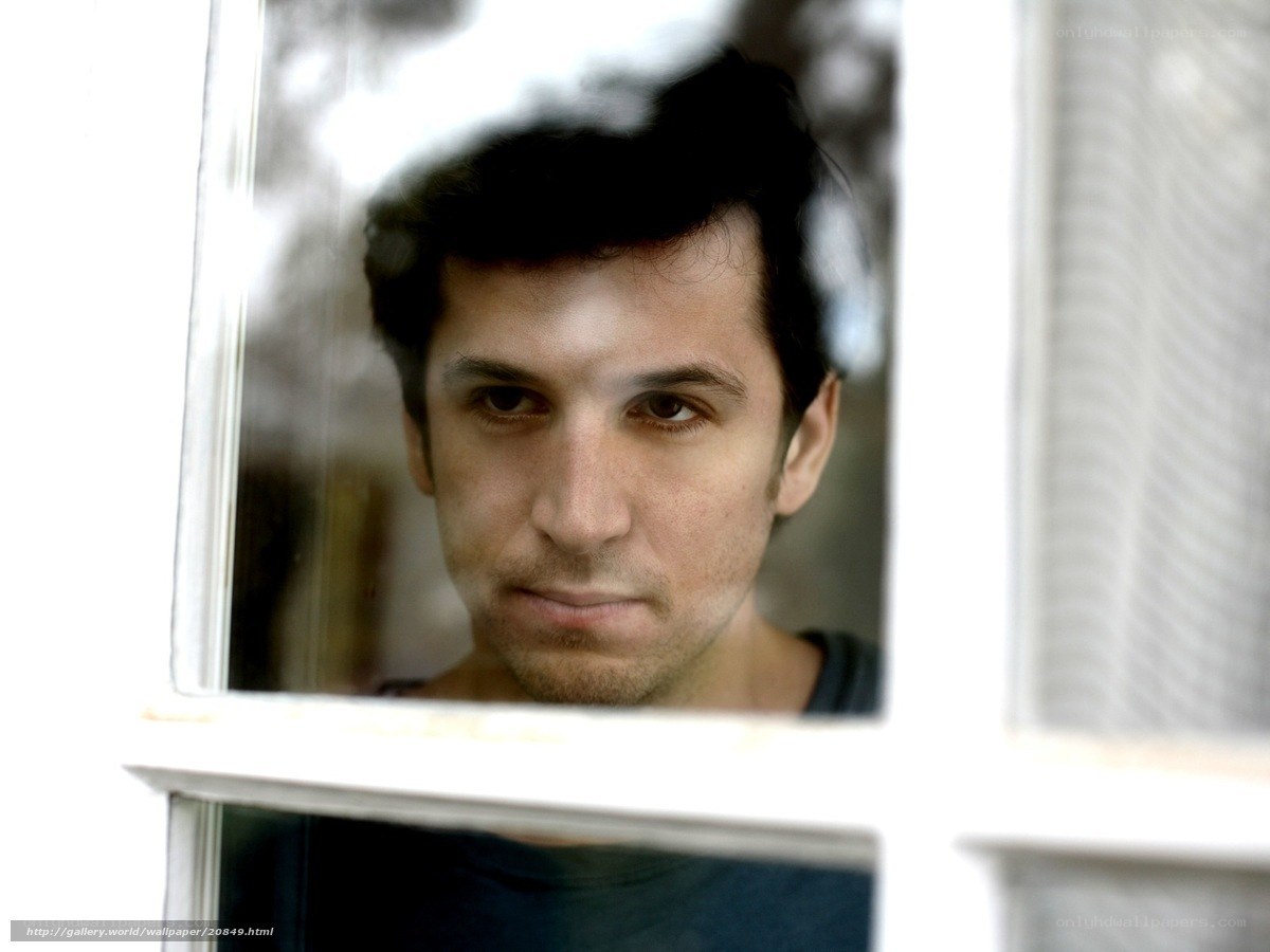man looking through window