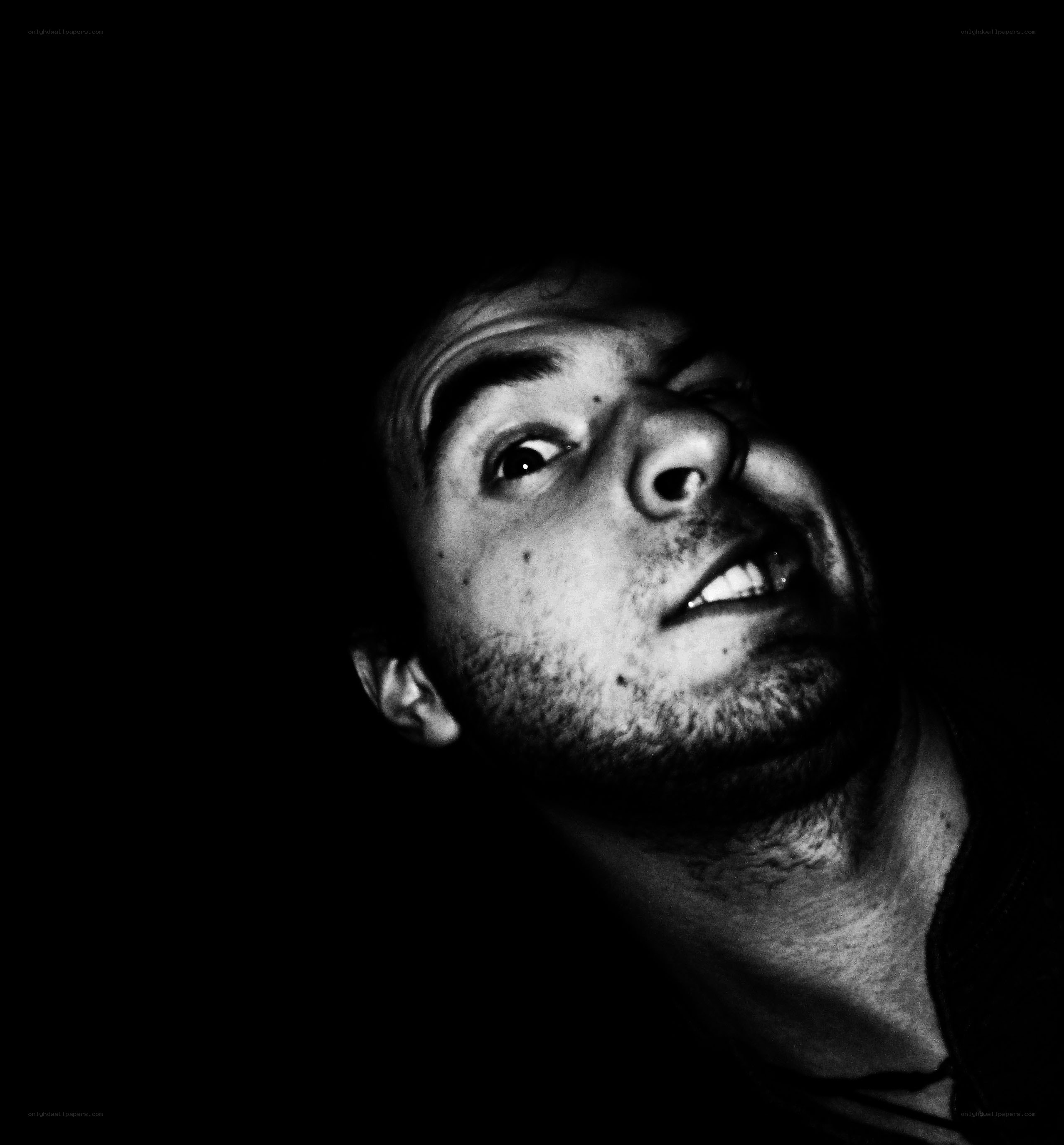 man looking up in darkness