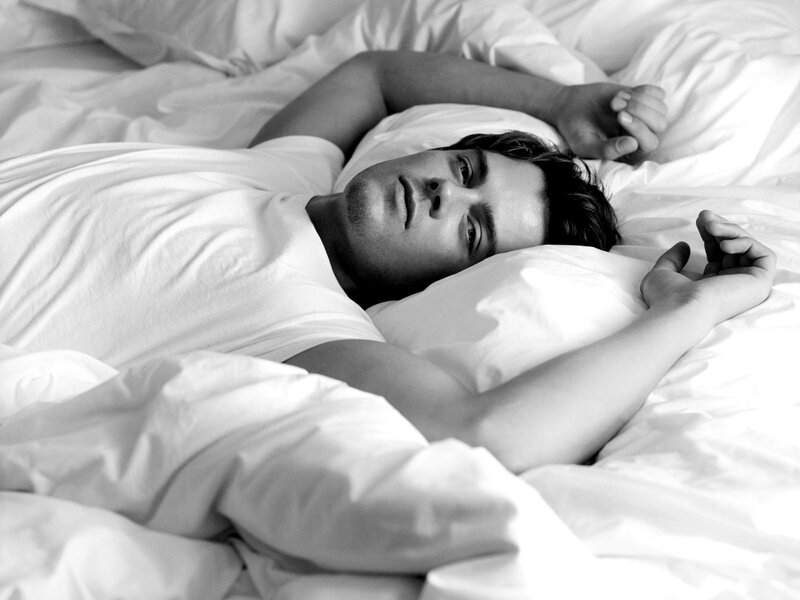 man lying in bed