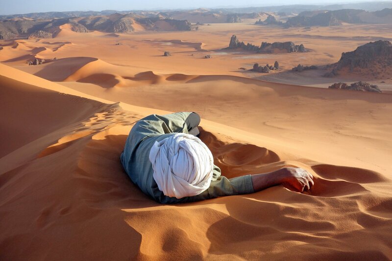 Man Lying in Desert
