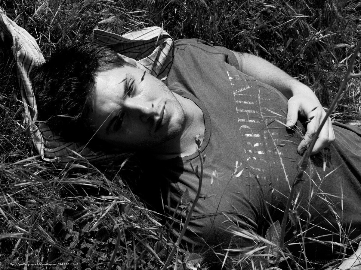 man lying in grass