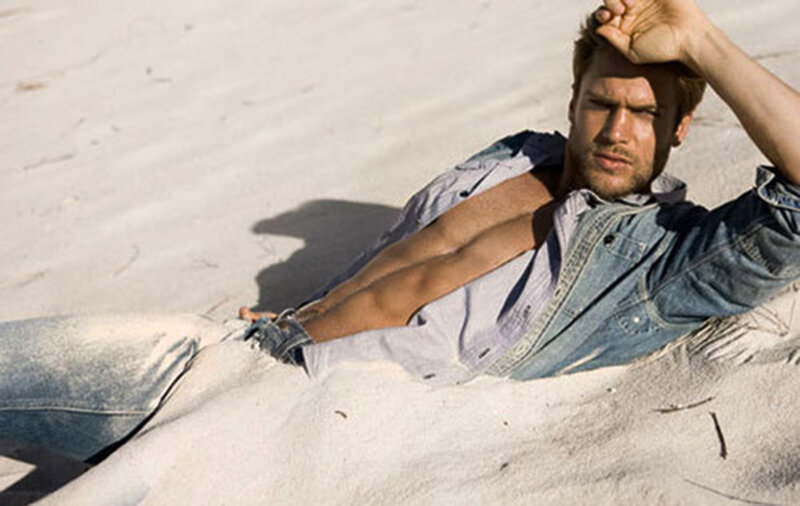 Man Lying in Sand