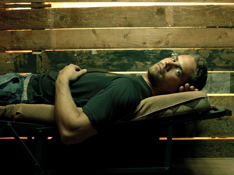 man lying on a cot