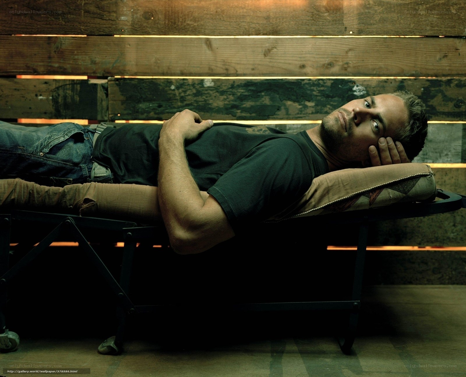 man lying on a cot