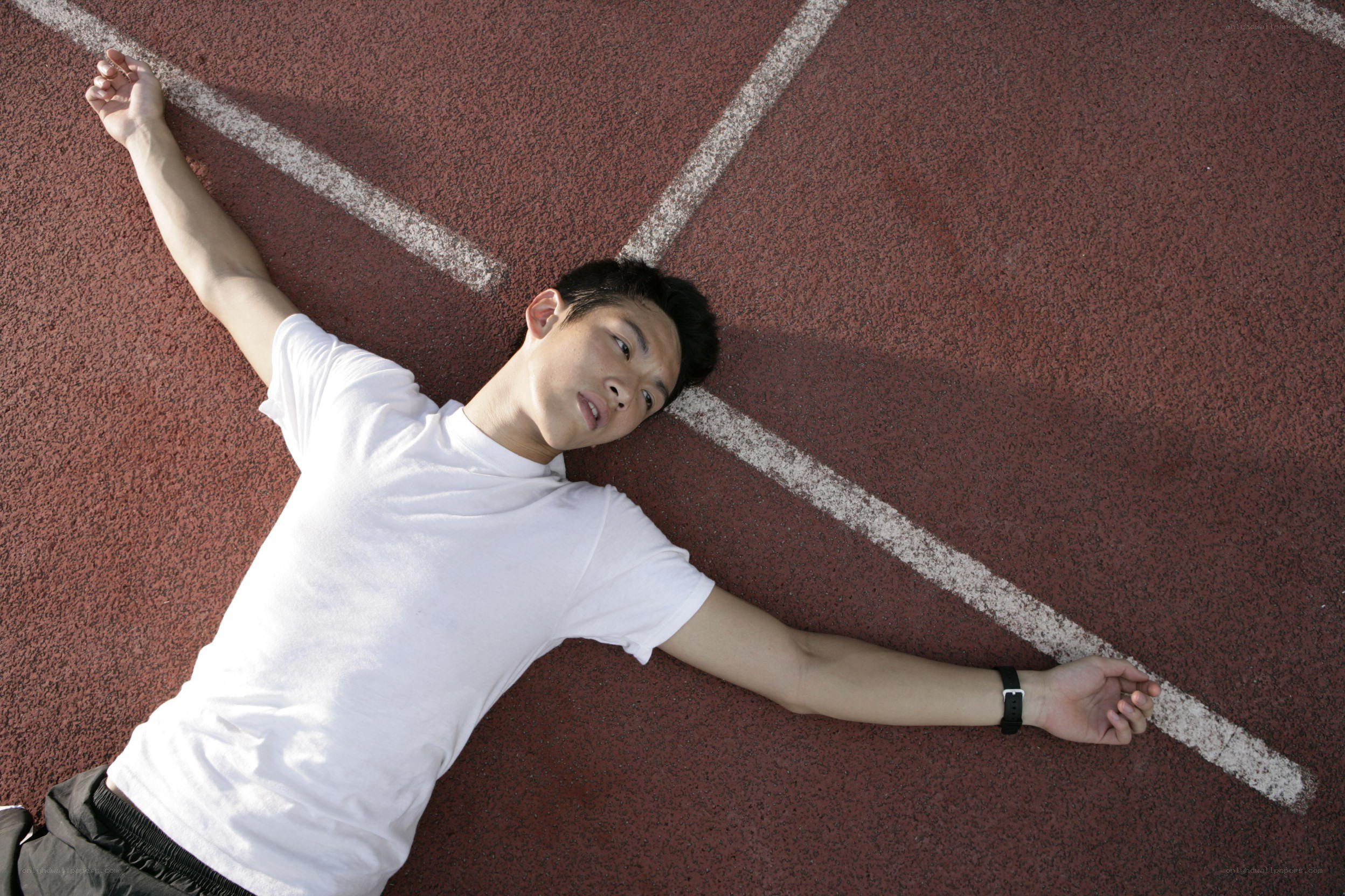 man lying on a track