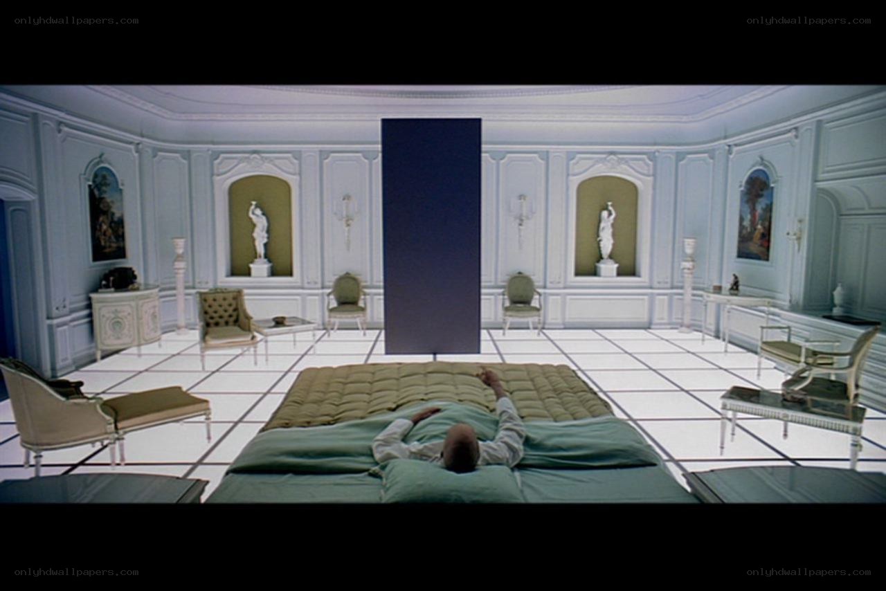 Man lying on bed in ornate room