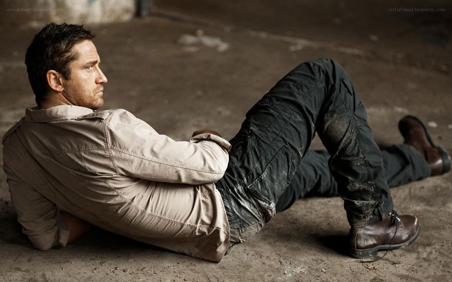 man lying on concrete floor