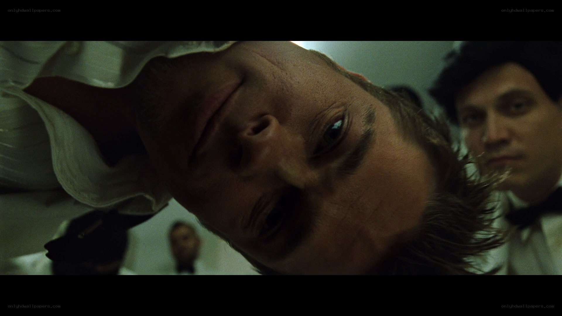 man lying on floor looking up
