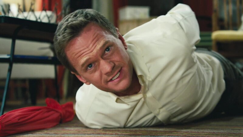 man lying on floor smiling