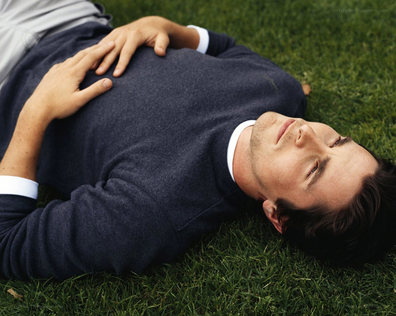 man lying on grass