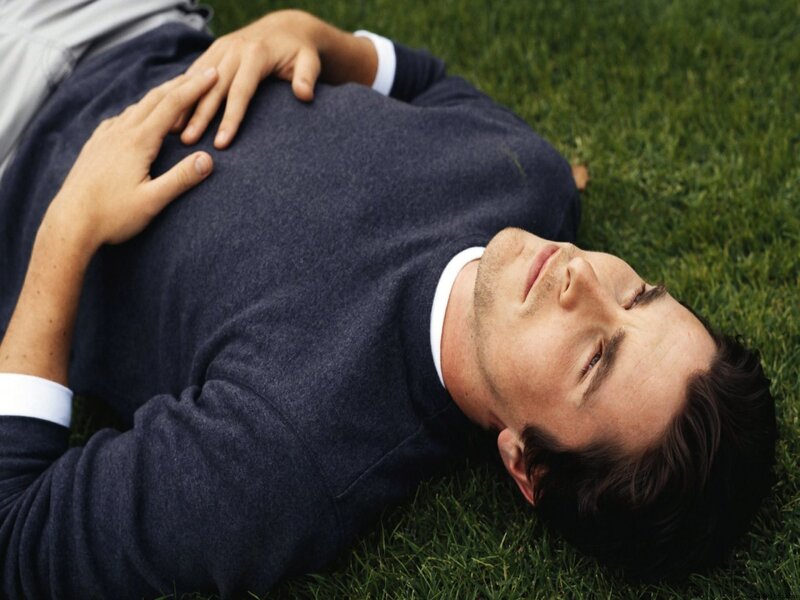 man lying on grass