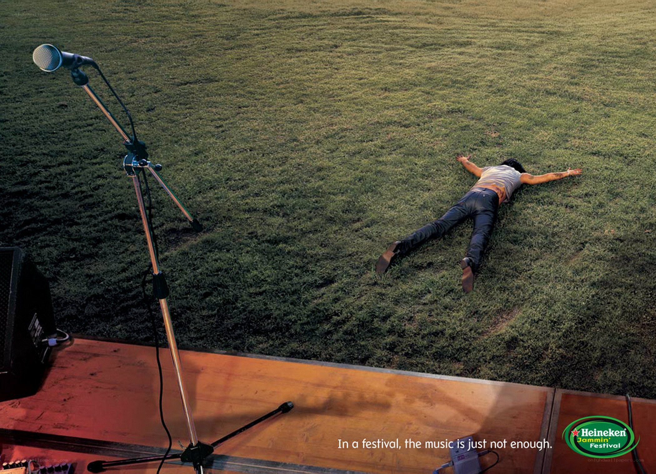 Man lying on grass at festival