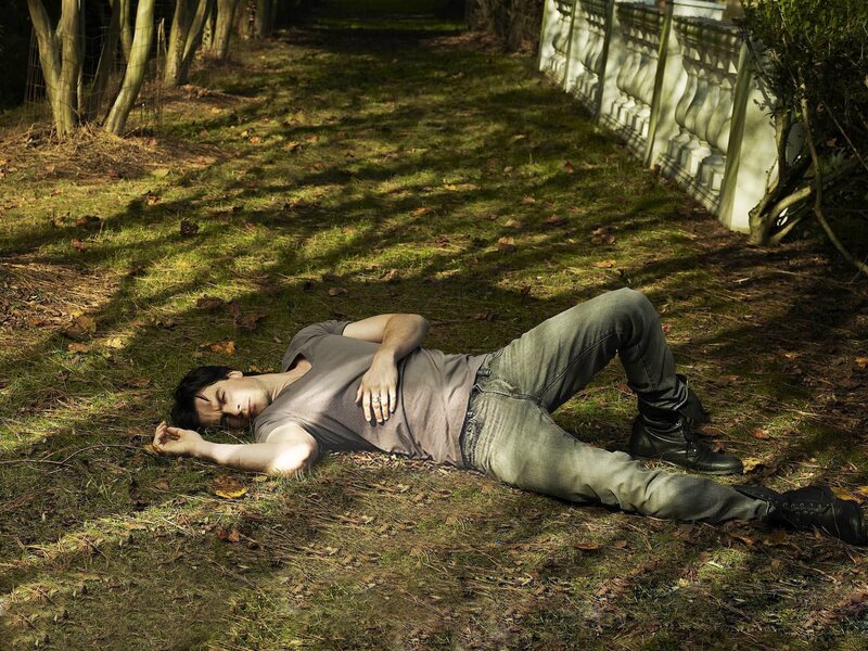 Man Lying on Grass — Green, Dramatic