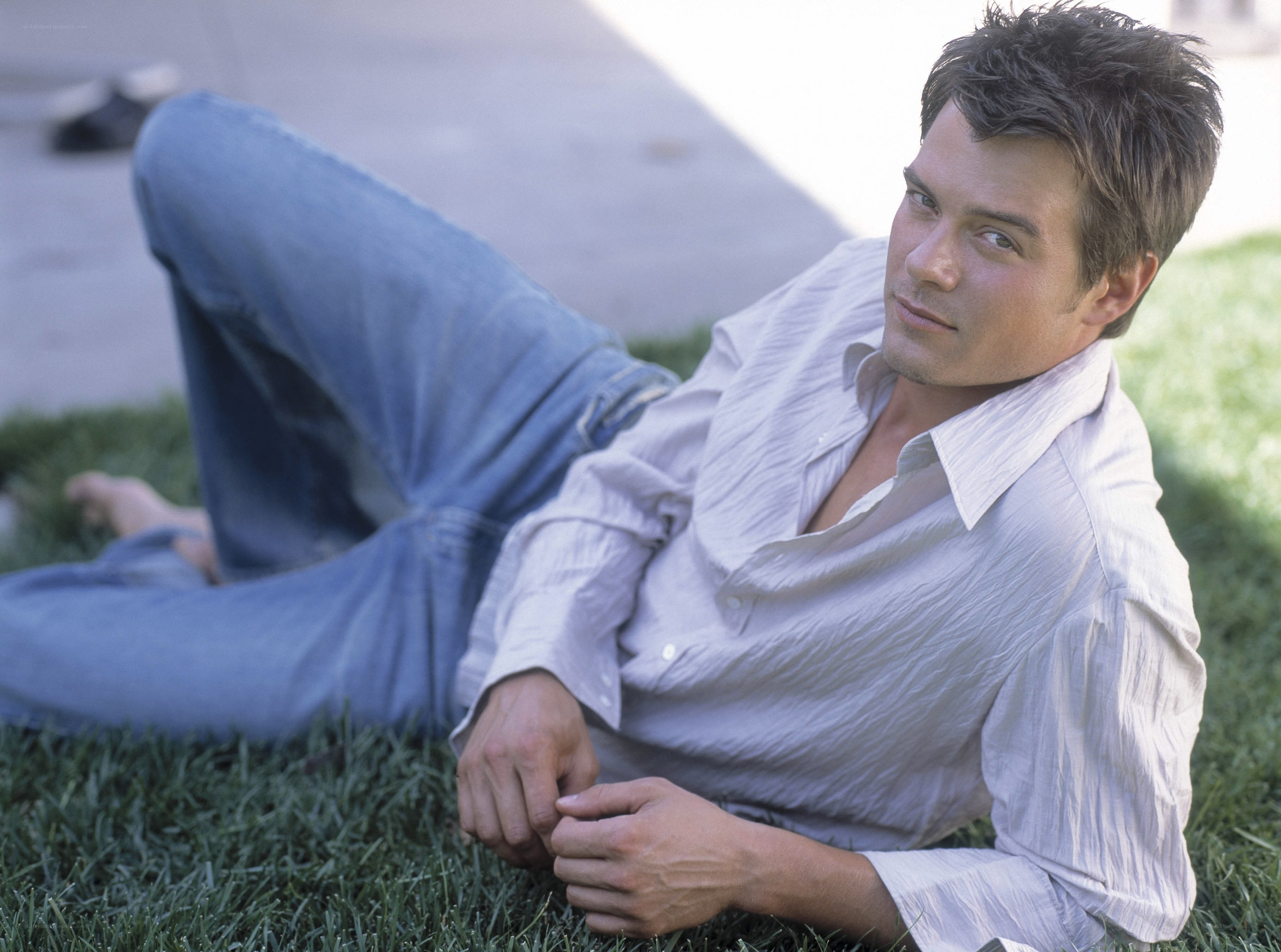man lying on grass outdoors