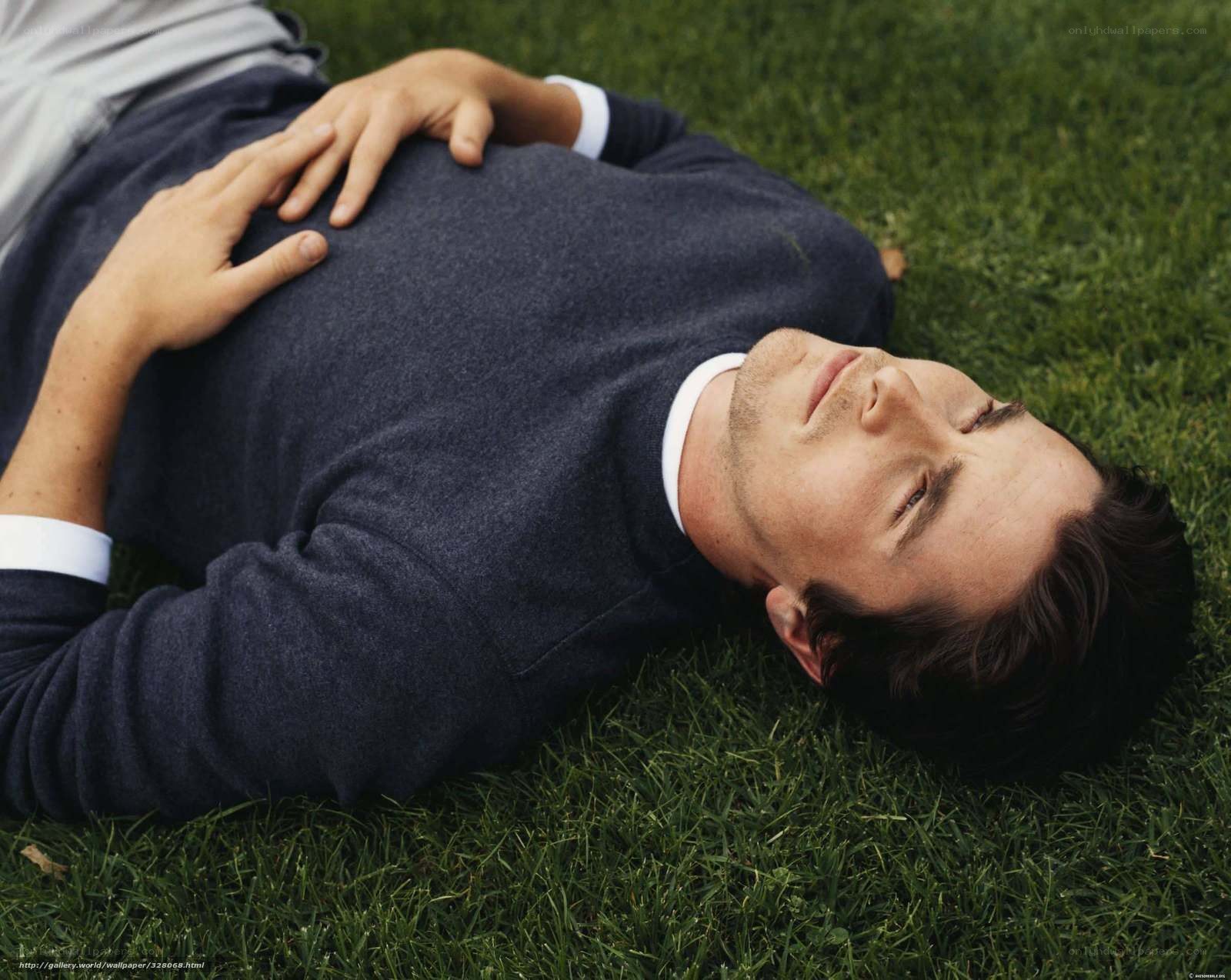 man lying on grass