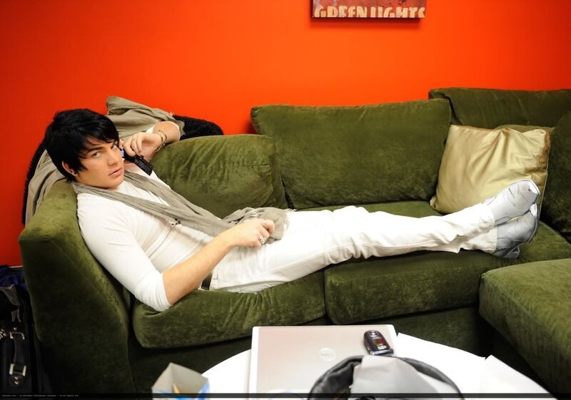Man Lying on Green Couch