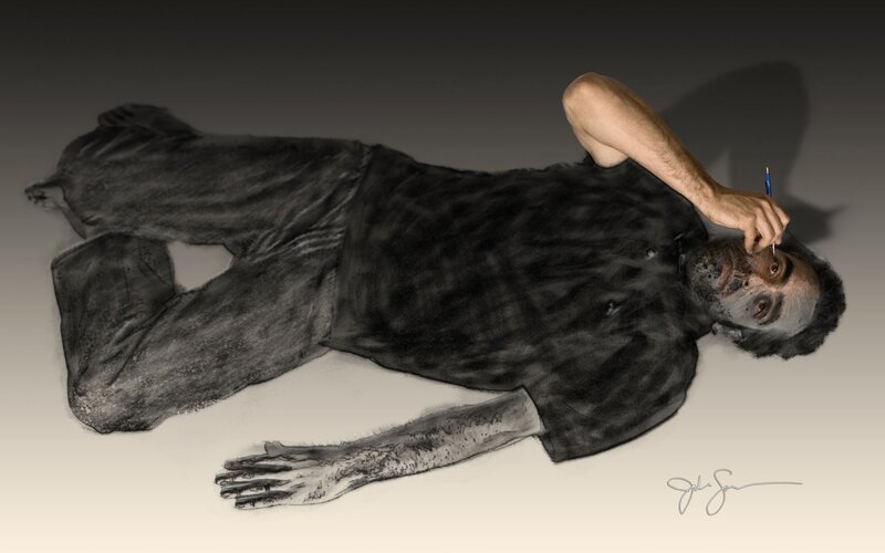 man lying on ground with pen