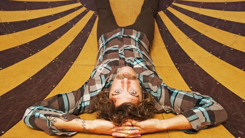 man lying on patterned floor