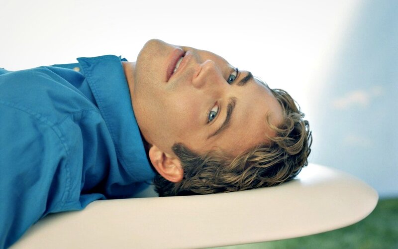 Man Lying on Surfboard