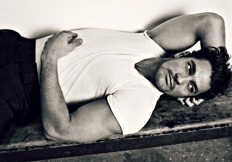 Man Lying on Wooden Surface — Black