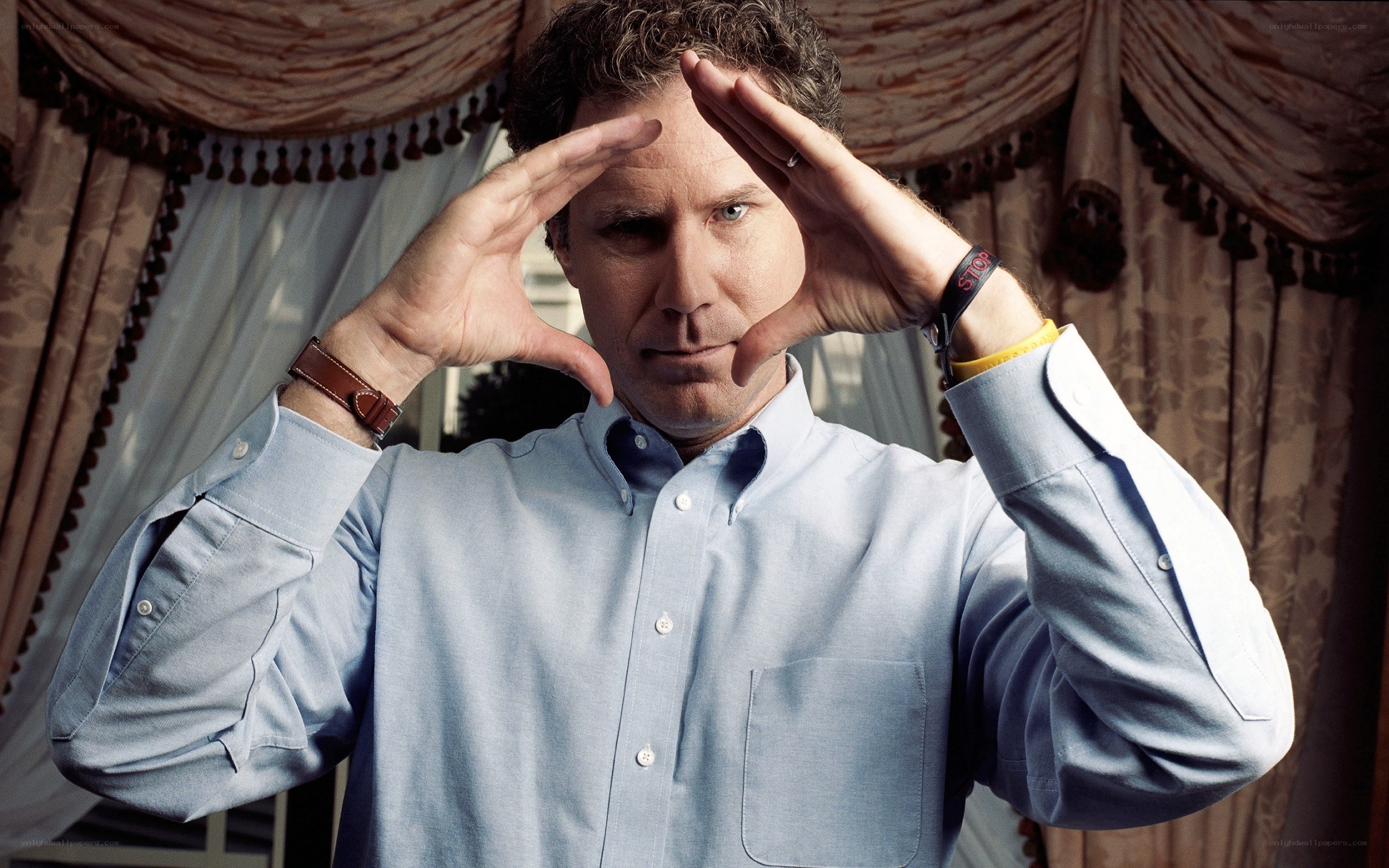 man making binoculars with hands