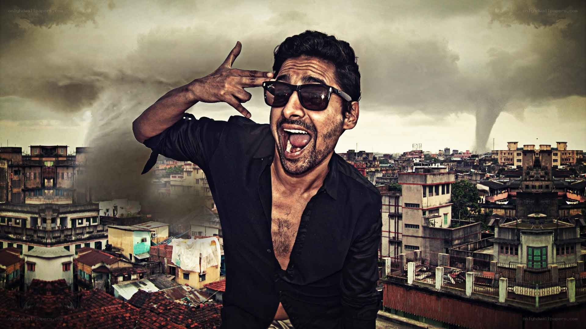 man making gun gesture in city