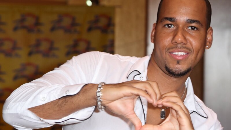 man making heart shape with hands