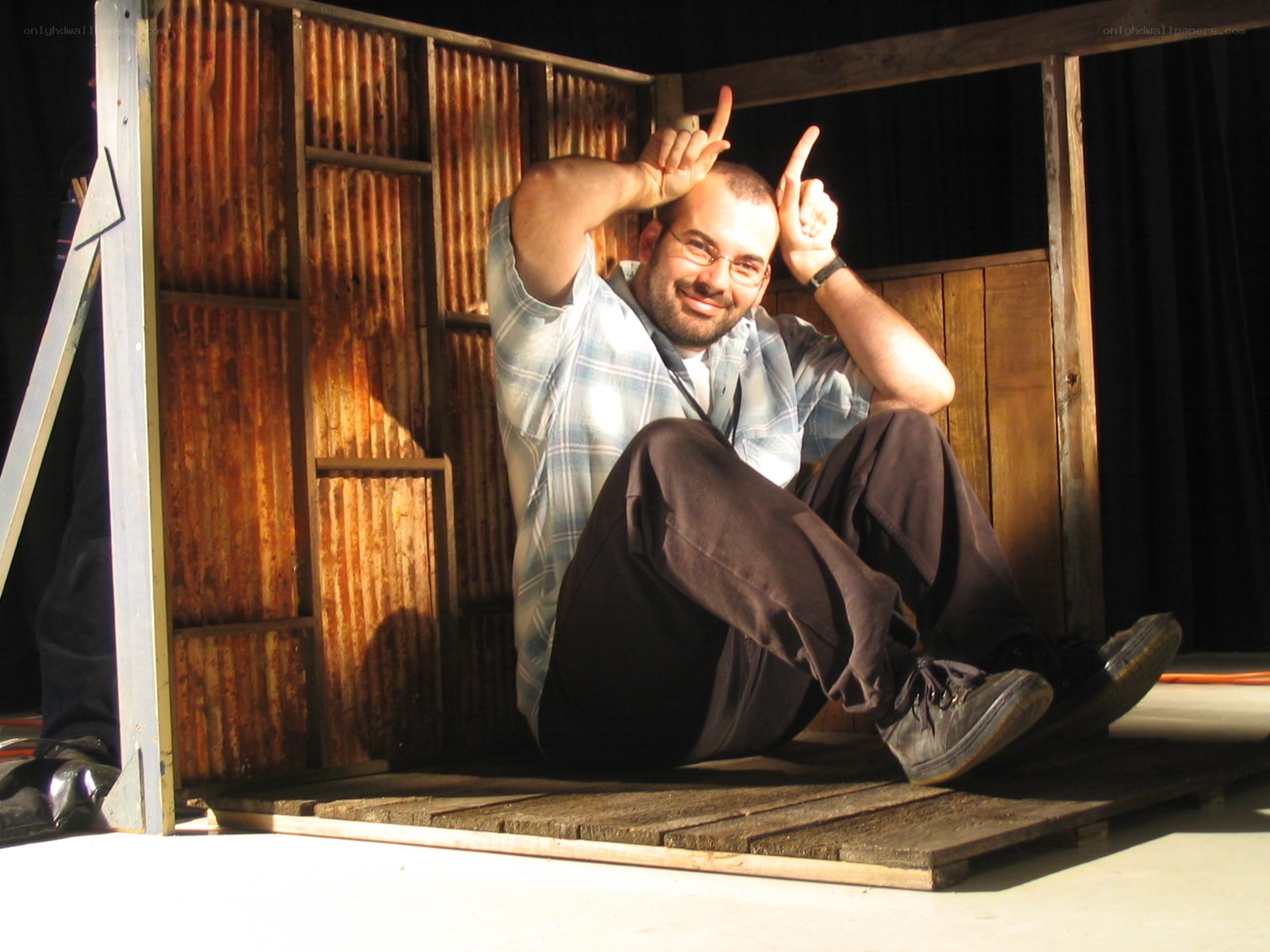 Man making horns gesture on stage