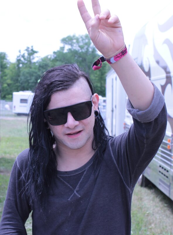 Man making peace sign at festival