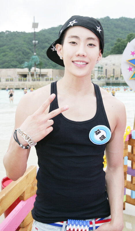 man making peace sign at water park