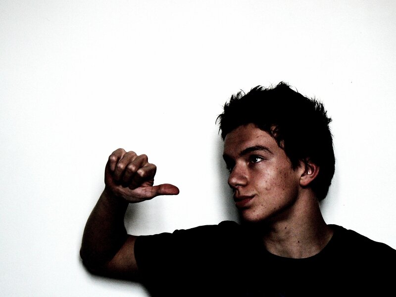 man making thumbs-down gesture